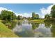 Community pond with fountain, playground and waterslide in the background at 8200 Sunset Hill Rd, Waxhaw, NC 28173