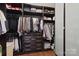 Spacious walk-in closet with custom shelving, drawers, and ample storage space at 8200 Sunset Hill Rd, Waxhaw, NC 28173
