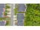 Drone shot showcasing this community's neighborhood layout with trees and parking at 8313 Carob Tree Ln, Charlotte, NC 28215