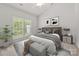 Serene bedroom with natural light, a plush bed, and stylish decor for a restful retreat at 8313 Carob Tree Ln, Charlotte, NC 28215