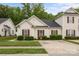 Charming single-story home with cream siding, red shutters and well-maintained landscaping at 8313 Carob Tree Ln, Charlotte, NC 28215