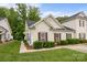 Charming home featuring manicured landscaping, a well-maintained lawn, and a cozy facade with red shutters at 8313 Carob Tree Ln, Charlotte, NC 28215