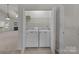 Laundry room featuring washer and dryer with doors open to the other rooms at 8313 Carob Tree Ln, Charlotte, NC 28215