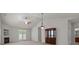 Bright living room featuring vaulted ceilings, fireplace, and elegant furnishings at 8313 Carob Tree Ln, Charlotte, NC 28215