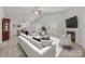 Open-concept living area boasts fireplace, ceiling fan, and adjacent dining space for seamless entertaining and relaxation at 8313 Carob Tree Ln, Charlotte, NC 28215