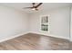 Bedroom with hard wood floors, a ceiling fan, neutral paint and natural light at 8325 Knights Bridge Rd, Charlotte, NC 28210
