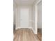 Inviting entryway with wood-look floors and white trim at 8325 Knights Bridge Rd, Charlotte, NC 28210