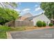 Exterior of building showing fence, siding, and brick at 8325 Knights Bridge Rd, Charlotte, NC 28210