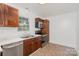 Well-lit kitchen featuring stainless appliances, granite countertops, and ample cabinet space at 8325 Knights Bridge Rd, Charlotte, NC 28210