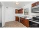Well-lit kitchen featuring stainless appliances, granite countertops, and ample cabinet space at 8325 Knights Bridge Rd, Charlotte, NC 28210