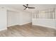 Spacious living room with wood-look floors and stylish room divider at 8325 Knights Bridge Rd, Charlotte, NC 28210
