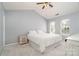 Bedroom with vaulted ceiling, ceiling fan, carpet and two windows at 8509 Sienna Dr, Charlotte, NC 28215