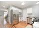 Modern kitchen features stainless steel appliances, granite countertops, and white cabinets with ample space at 8509 Sienna Dr, Charlotte, NC 28215