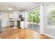 Bright kitchen features a sliding glass door to the deck, white cabinets, and stainless steel appliances at 8509 Sienna Dr, Charlotte, NC 28215