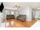 Spacious living room area featuring hardwood floors, comfortable seating, and abundant natural light at 8509 Sienna Dr, Charlotte, NC 28215
