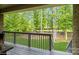 Relaxing backyard view, accessible from deck, offering serene views of wooded landscape at 876 Hardin St # B24, Lancaster, SC 29720