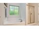 Bathroom featuring a separate tub and glass-enclosed shower at 876 Hardin St # B24, Lancaster, SC 29720
