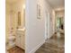 Neutral hallway with wood flooring leading past the bathroom to the main bedroom at 876 Hardin St # B24, Lancaster, SC 29720