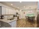 Bright kitchen featuring granite counters, stainless appliances, and adjacent breakfast nook with table at 876 Hardin St # B24, Lancaster, SC 29720