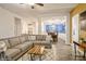 Open-concept living room showcasing the transition to dining area, gray sofa, and stylish rug at 876 Hardin St # B24, Lancaster, SC 29720