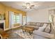 Cozy living room featuring a gray sofa, ceiling fan, and natural light from the window at 876 Hardin St # B24, Lancaster, SC 29720
