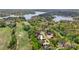 Aerial view of luxury home with lake and golf course views and beautifully landscaped grounds at 89 Wexford Pt, Hickory, NC 28601