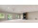 Spacious basement featuring a stone fireplace, recessed lighting, and a walkout to the backyard at 89 Wexford Pt, Hickory, NC 28601