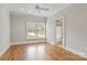 Bedroom featuring hardwood floors, a ceiling fan, and a view from the window at 89 Wexford Pt, Hickory, NC 28601