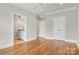 Bright bedroom boasts hardwood floors, a ceiling fan, and neutral paint at 89 Wexford Pt, Hickory, NC 28601