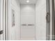 Interior view of residential elevator with white paneling and modern controls at 89 Wexford Pt, Hickory, NC 28601