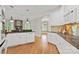 Bright kitchen with white cabinets, granite countertops, and hardwood floors at 89 Wexford Pt, Hickory, NC 28601