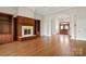 Expansive living room with hardwood floors, built-in shelving, and an arched doorway at 89 Wexford Pt, Hickory, NC 28601