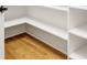 Walk-in pantry featuring white shelving and hardwood flooring at 89 Wexford Pt, Hickory, NC 28601
