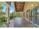 Covered patio featuring a brick exterior, stone flooring, and a scenic view at 89 Wexford Pt, Hickory, NC 28601