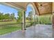 Covered patio with stone flooring, columns, and a view of the green landscape at 89 Wexford Pt, Hickory, NC 28601
