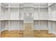 Spacious walk-in closet with custom shelving, hanging rods, and a full-length mirror at 89 Wexford Pt, Hickory, NC 28601
