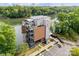 Aerial view of waterfront restaurant with outdoor seating and modern architecture, set against a lush green landscape at 962 Herrons Ferry Rd, Rock Hill, SC 29730
