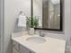 Clean bathroom featuring white countertops, a mirror, and greenery at 962 Herrons Ferry Rd, Rock Hill, SC 29730