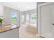 Bright bathroom featuring a soaking tub, glass-enclosed shower, double sinks, and large windows at 962 Herrons Ferry Rd, Rock Hill, SC 29730