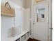 Inviting entryway with built-in bench, coat hooks, storage, and natural light at 962 Herrons Ferry Rd, Rock Hill, SC 29730