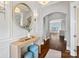 Elegant foyer featuring hardwood floors, a decorative mirror, and a glimpse into the dining and living areas at 962 Herrons Ferry Rd, Rock Hill, SC 29730