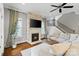 Comfortable living area with a stone fireplace and lots of light from windows at 962 Herrons Ferry Rd, Rock Hill, SC 29730