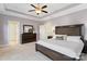 Spacious main bedroom with tray ceilings, dresser, carpet, and ceiling fan at 962 Herrons Ferry Rd, Rock Hill, SC 29730