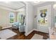 Cozy sitting room featuring hardwood floors, comfortable seating, large windows, and a charming view at 962 Herrons Ferry Rd, Rock Hill, SC 29730