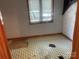 Small bedroom with damaged floors and a broken window at , Salisbury, NC 28147
