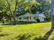 Charming single-story home featuring a covered porch and a well-maintained front yard with mature trees at , Salisbury, NC 28147