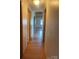 Interior hallway with hardwood floors and neutral walls leading to various rooms in the home at , Salisbury, NC 28147