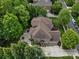Stunning aerial view of the home featuring the backyard patio, lush landscaping, and ample parking at 1030 Westbury Dr, Matthews, NC 28104