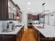 Gourmet kitchen boasts custom cabinets, marble countertops and stainless steel appliances at 1030 Westbury Dr, Matthews, NC 28104