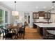 Bright, open kitchen and dining area featuring hardwood floors and stainless steel appliances at 1030 Westbury Dr, Matthews, NC 28104